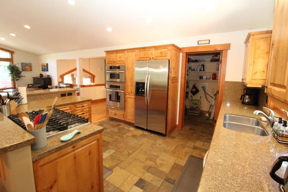 Kitchen: view d. Note walk-in pantry/laundry room