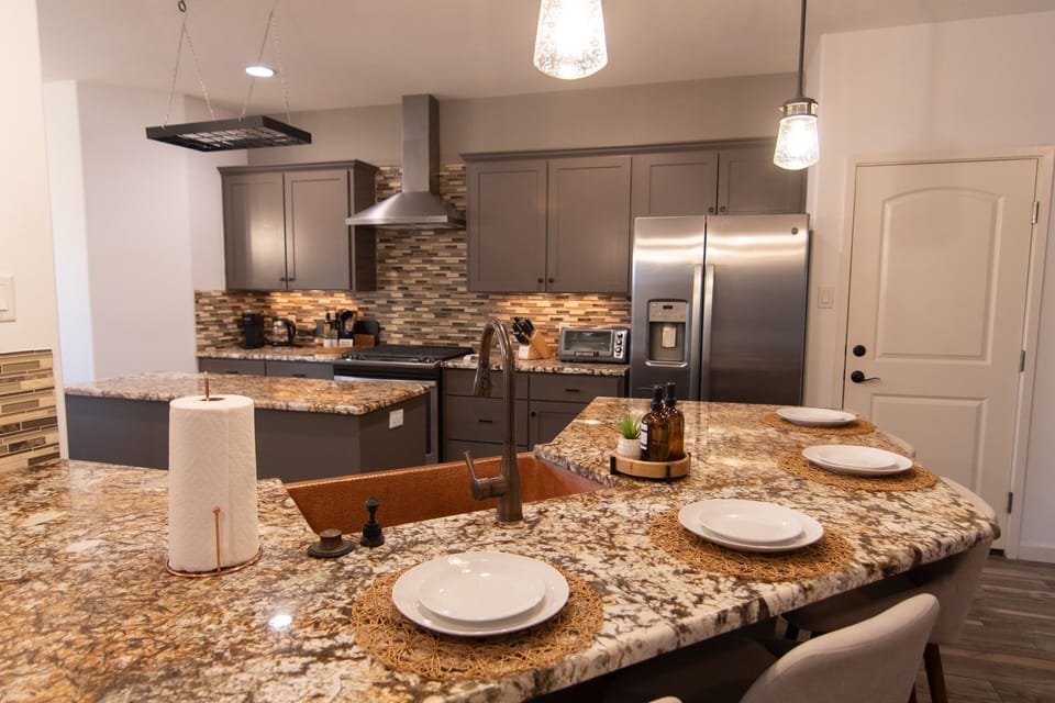 Fully-equipped with stainless steel appliances, plus seating for 4 at bar.