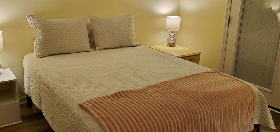 Queen bedroom third floor with Roku TV shared balcony and spacious closet