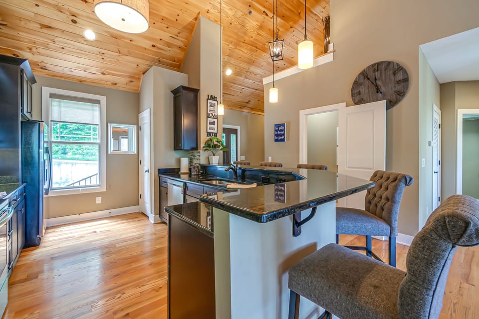 Kitchen with bar top seating. Great for socializing during meal prep.