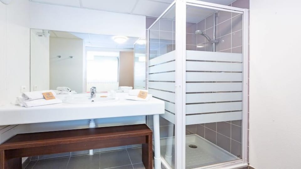 Freshen up in the bathroom after a day of adventure.