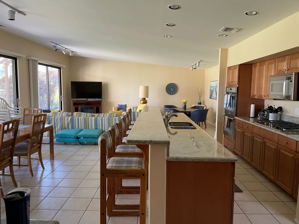 Open concept kitchen, dining and living area