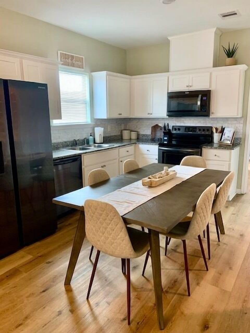 Open kitchen with table seating for 6