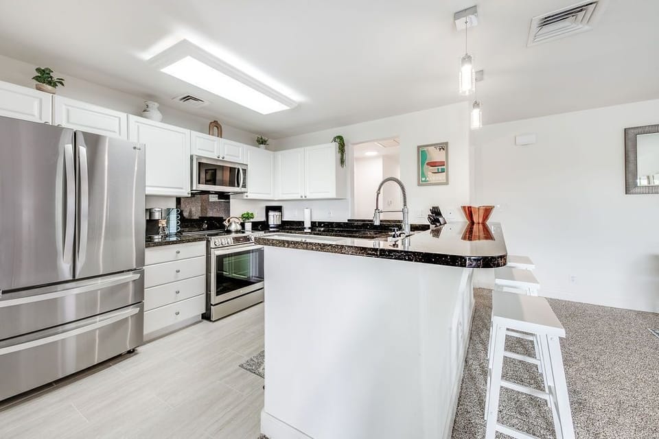 Fully stocked kitchen with Keurig maching. 