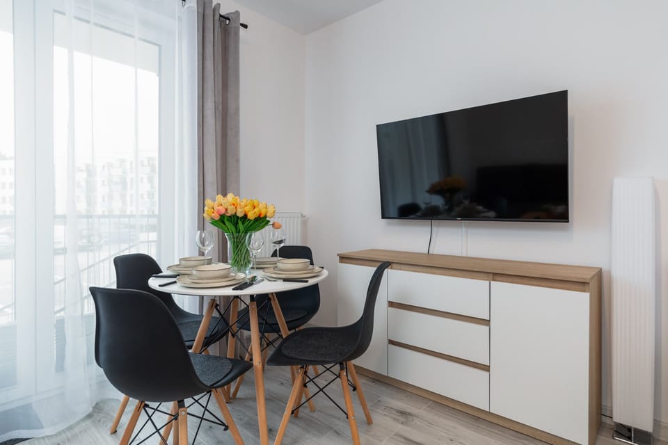 Large table with chairs for eating communal meals. 