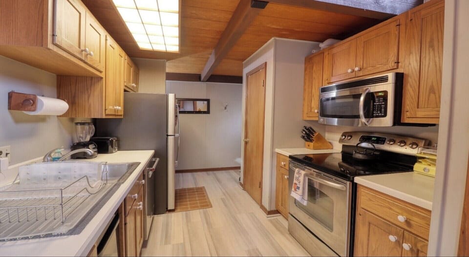 Stainless steel appliances, teash compactor and icemaker in freezer