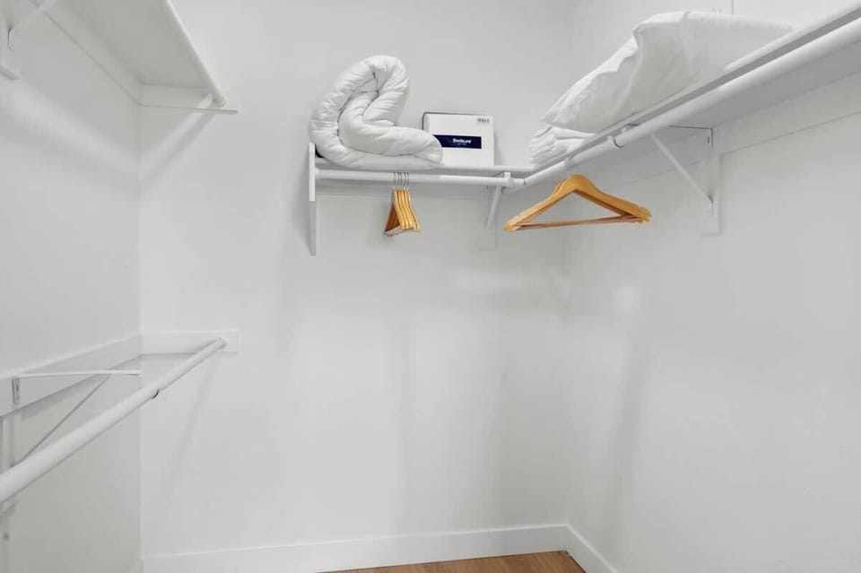 Huge walk in closet with extra futon linens