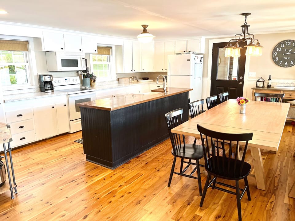 Fully stocked kitchen with large dining table - seats 10-12