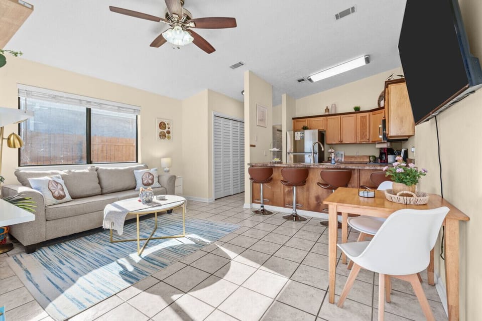 Open concept kitchen/ living room with bar stools to hang out in!