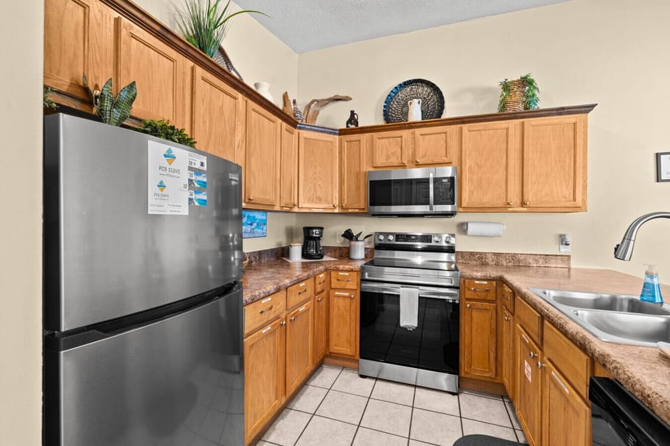 The kitchen space with brand new stainless stove and microwave!