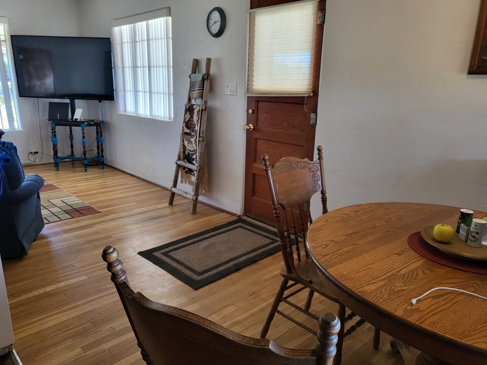 from Kitchen shows carport entrance and part of living room/TV.