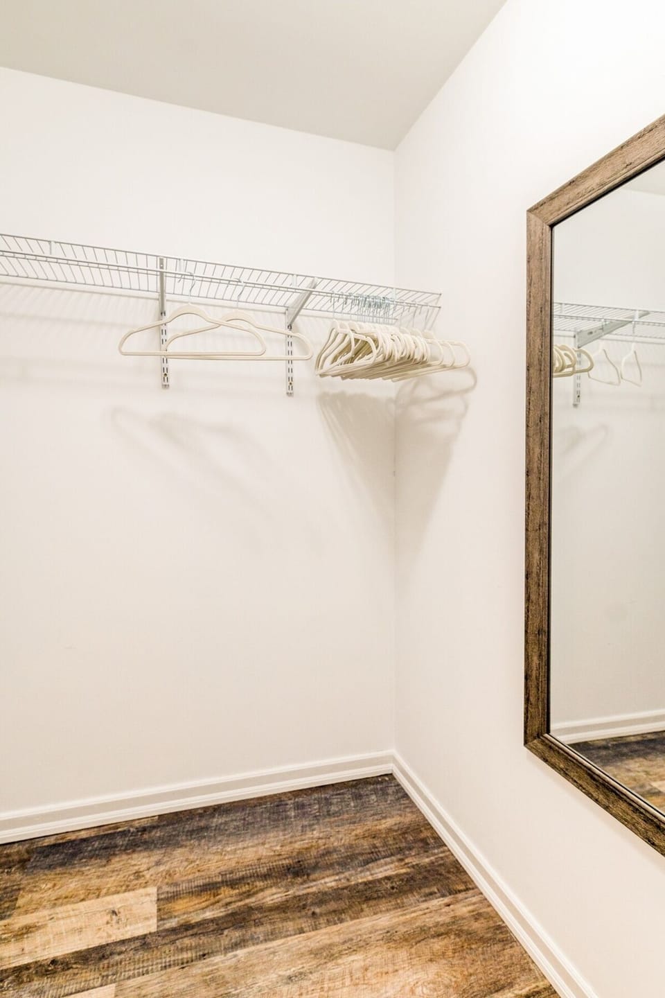 Bedroom #2: Walk-in Closet with Iron and Ironing Board.