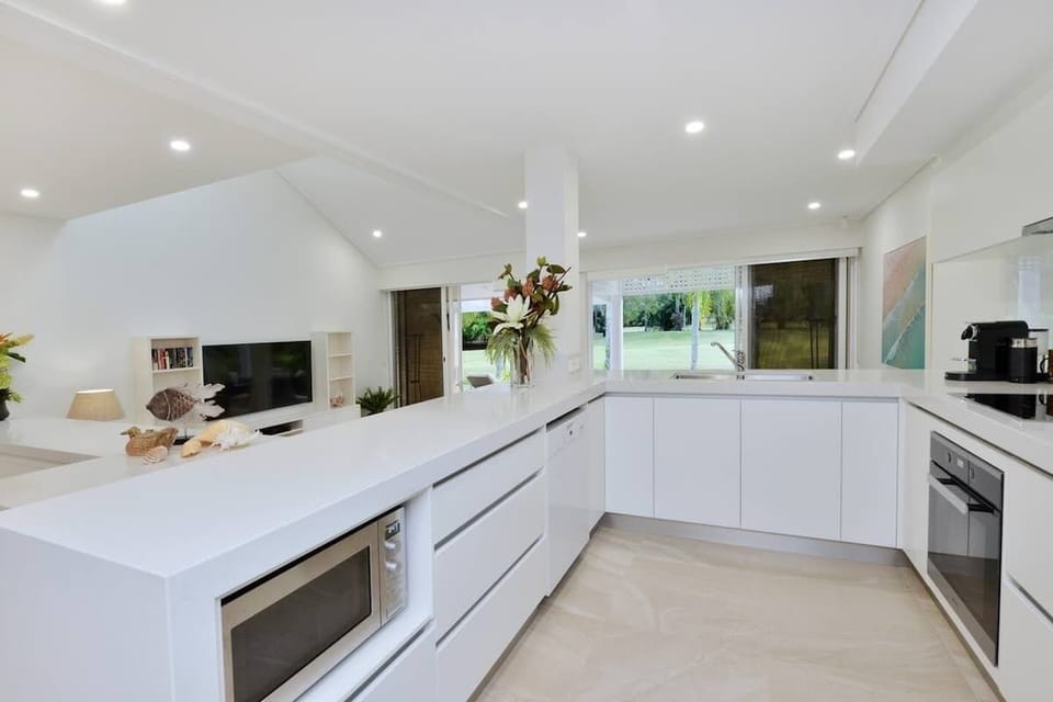 The modern kitchen is fully equipped and perfect for creating delectable dishes to enjoy with the group
