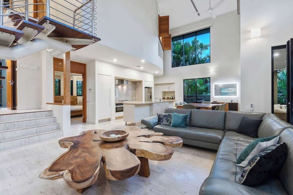 Embrace the main living area's open-plan design, where comfort meets style. Relax on the oversized lounge with a spot of TV.