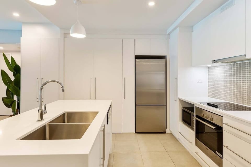 Whip up culinary delights in the stunning remodelled kitchen, offering an oversized sink, dishwasher and premium appliances. 