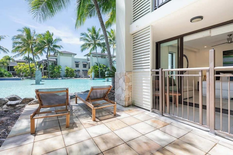 This apartment benefits from direct access to the resort's pool, with a gate leading out from the private patio.