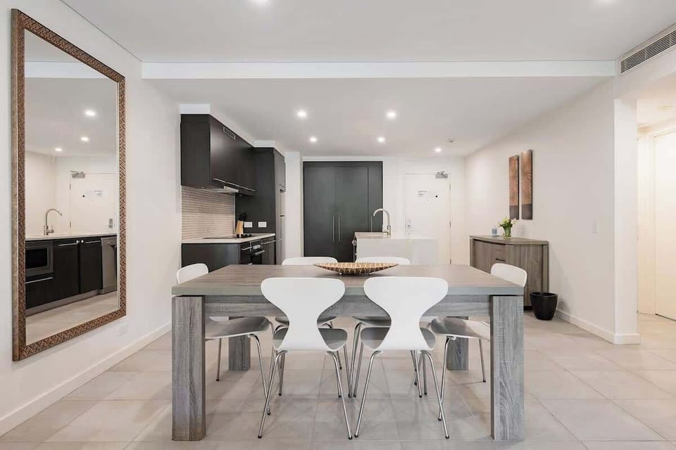 Enjoy casual meals in the dining area, featuring a six-seater table. 