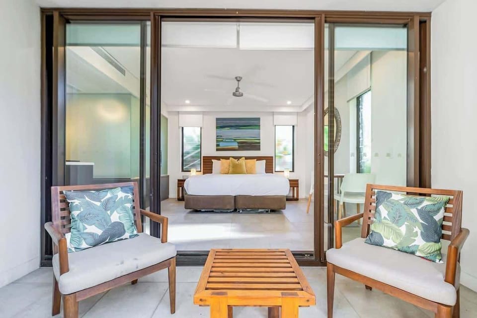 Awaken in serenity within the expansive primary king-sized bedroom, complete with a private hot tub and a tranquil balcony for your exclusive relaxation.
