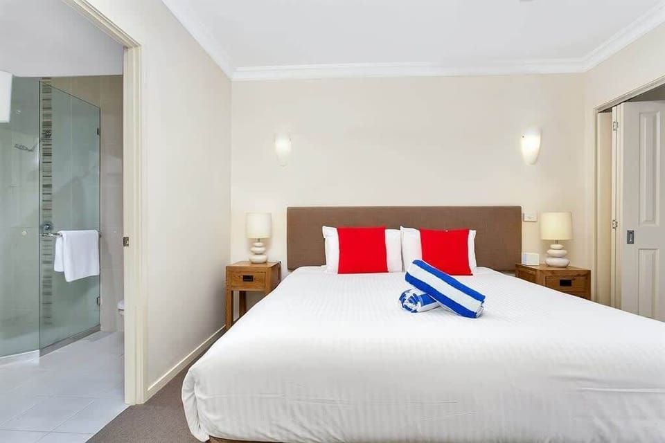 The bedroom offers direct access to the pristine ensuite.
