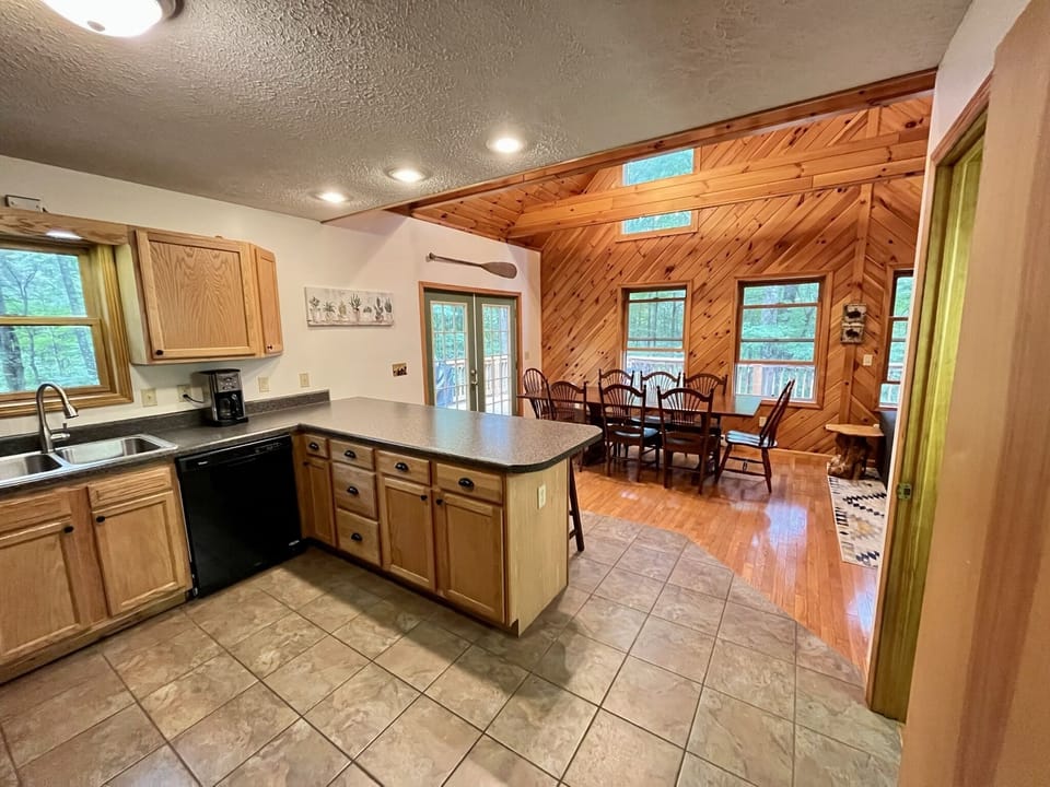 Open concept living space with kitchen, dining room, and living room connected