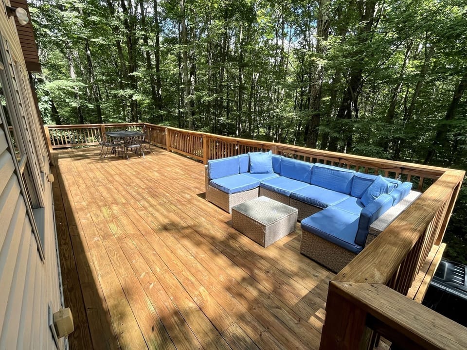 Expansive elevated deck with outdoor seating and dining table