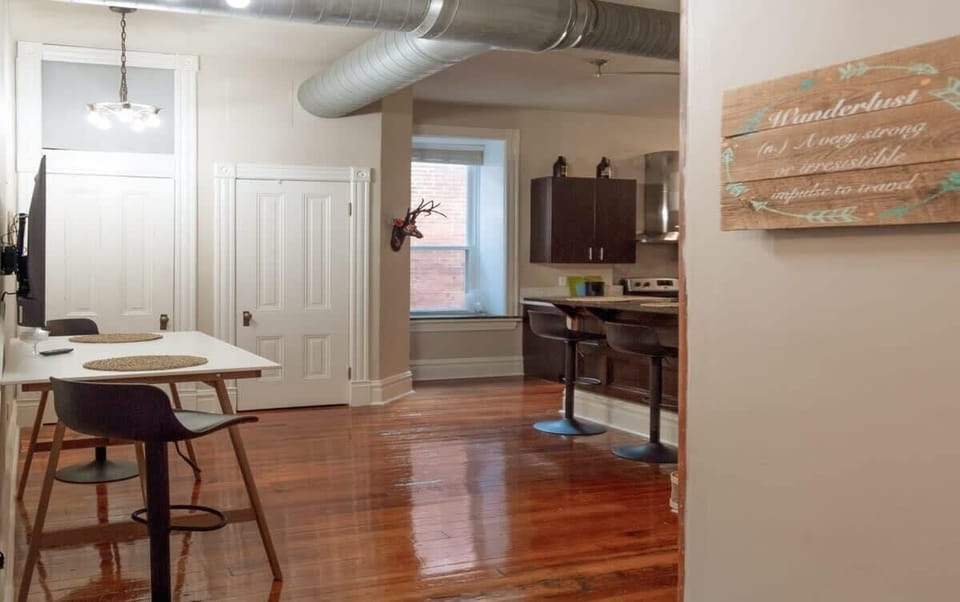 Open dining and kitchen area with plenty of space to gather, dine, and unwind after a day exploring the city. #OpenConcept 