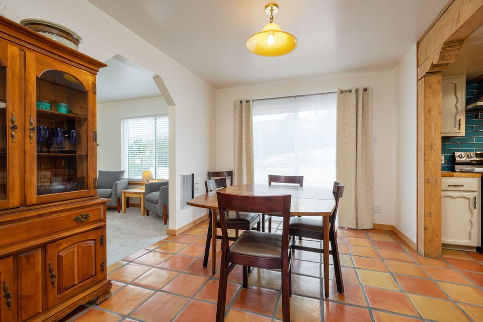 Dining room with access to family room, kitchen and backyard via slider.