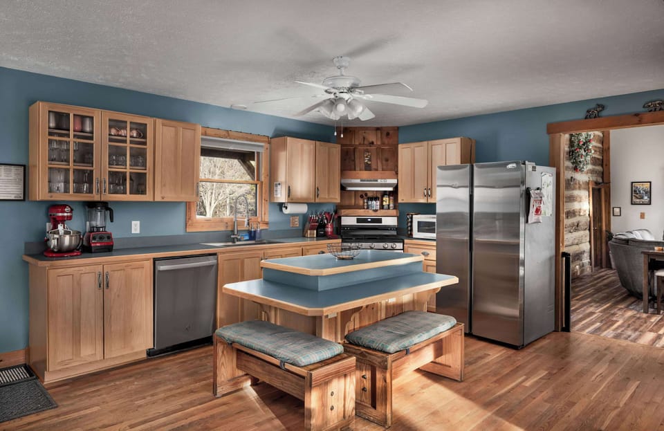 The heart of the home—fully stocked farmhouse kitchen with a big island for cooking together.