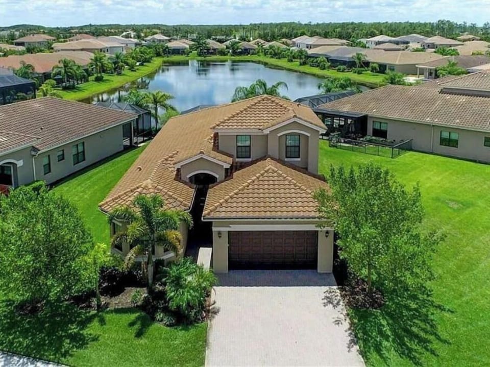 Aerial view of home on lake