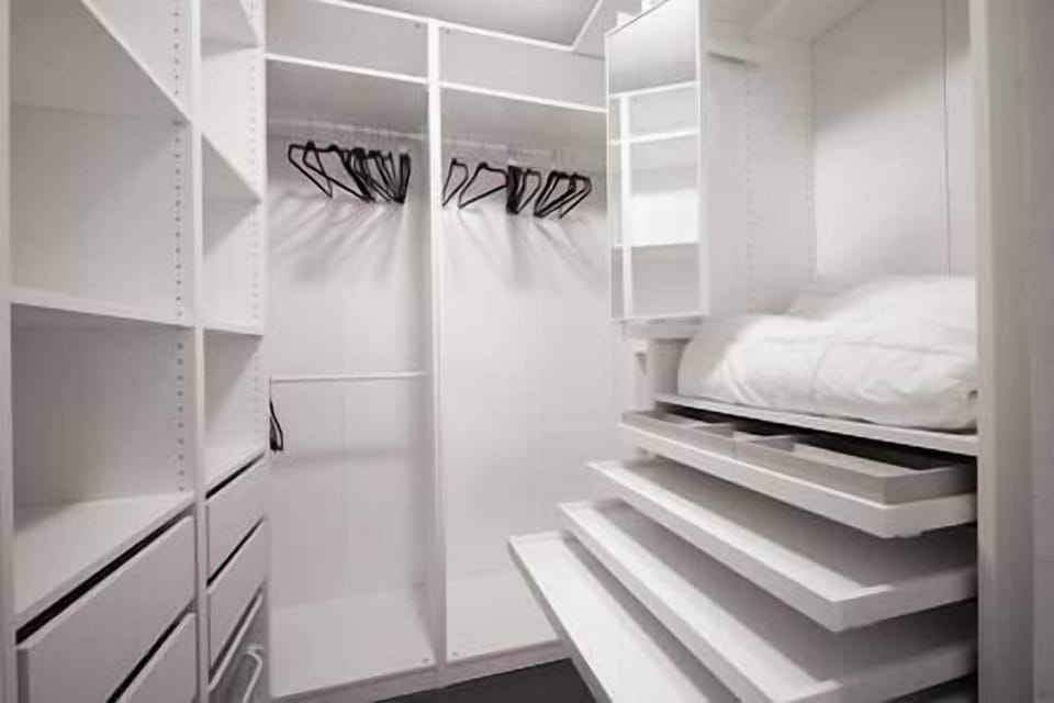 Spacious custom closet system with lots of storage spaces