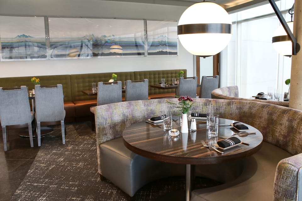 Dine comfortably in a modern restaurant with plush banquette seating.