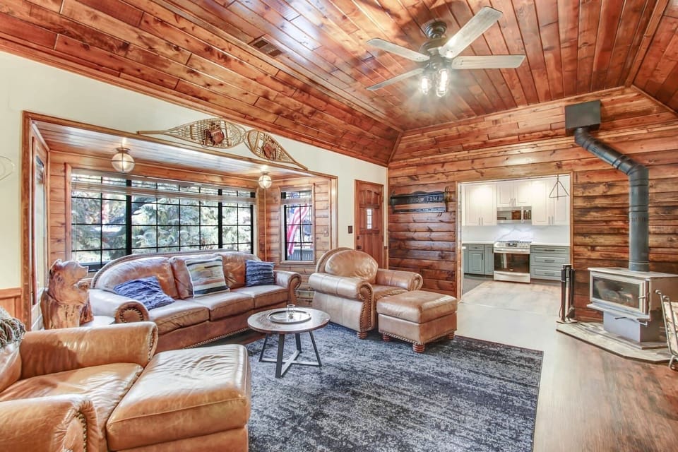 Cozy cabin living room with log stove 