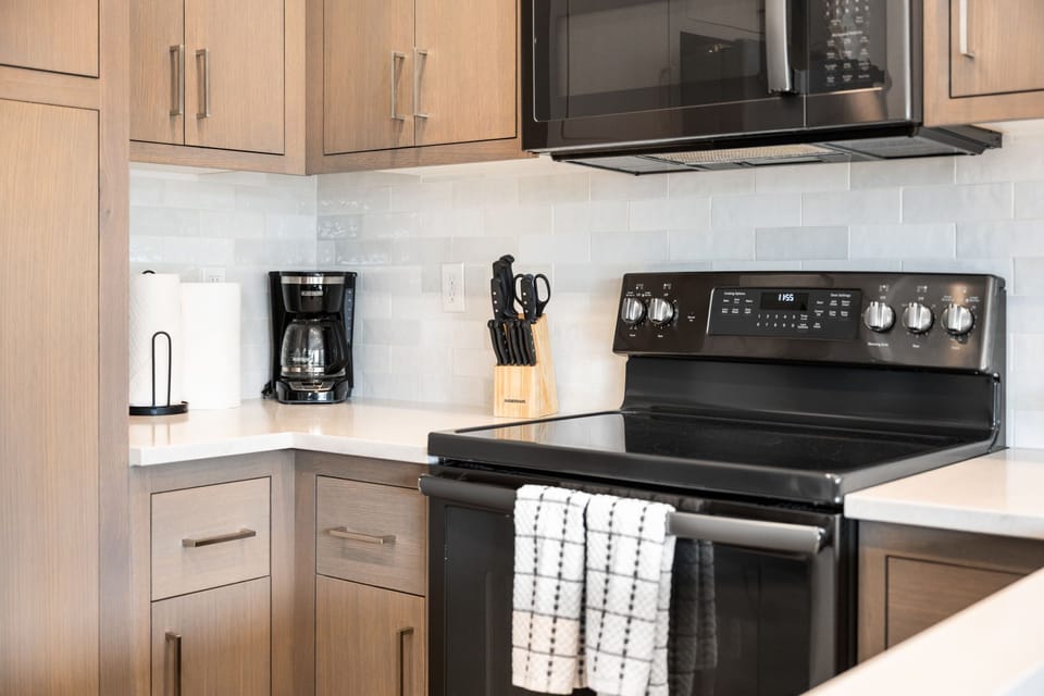 Kitchen is equipped with a full oven range and all of the basics needed to cook meals