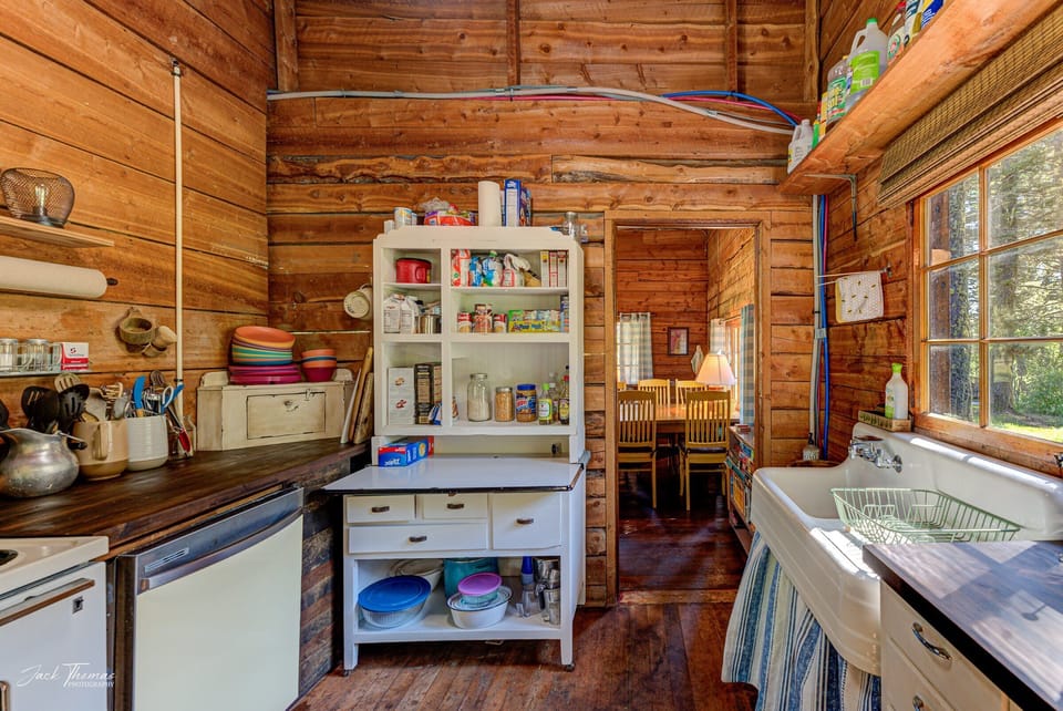 Pantry items, some plates and bowls, utensils 