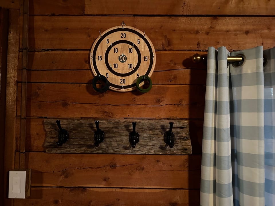 Ring toss and coat hooks in Main Cabin great room