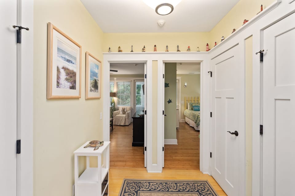 Downstairs hallway leading to bedrooms. Laundry area and closet.