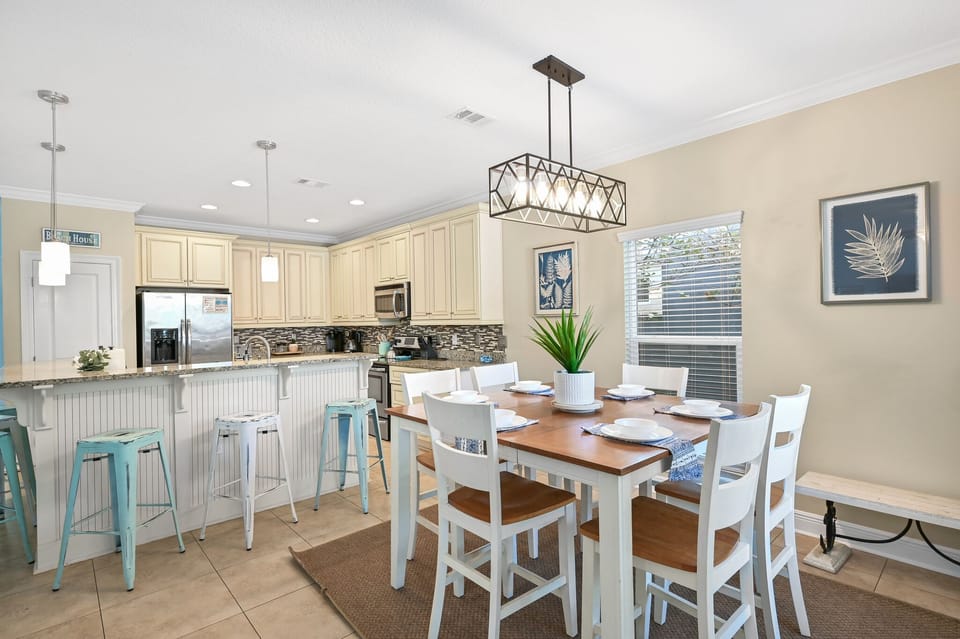 Your bright kitchen and dining space combines coastal charm with modern convenience, perfect for cooking and gathering together.