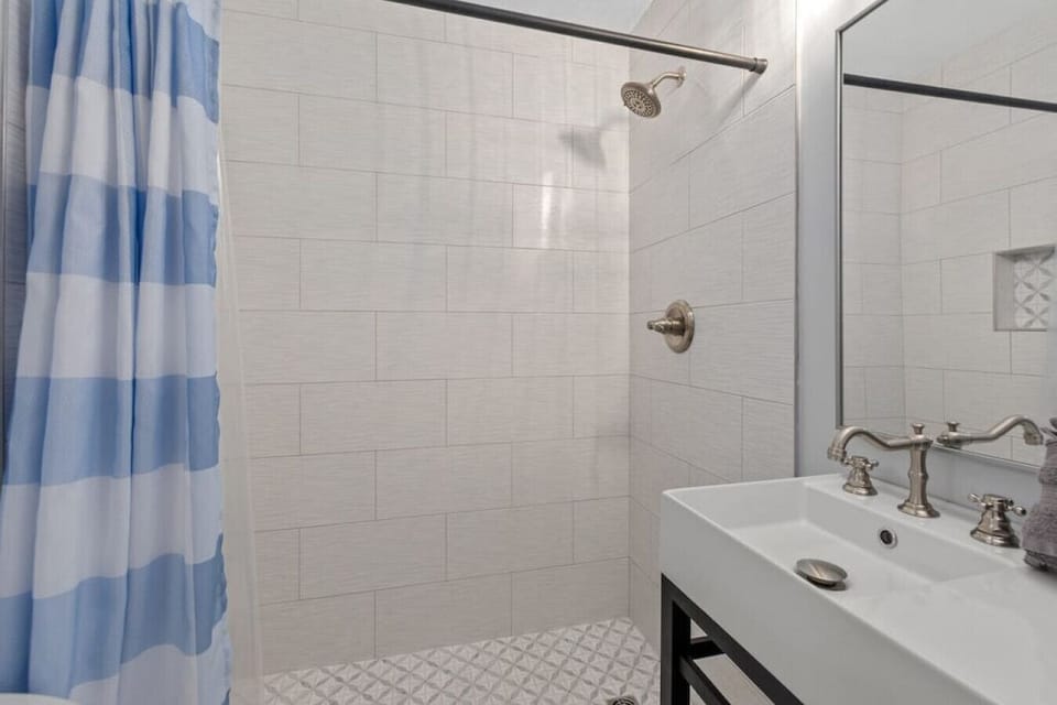 Full guest bath with walk-in shower, custom tile