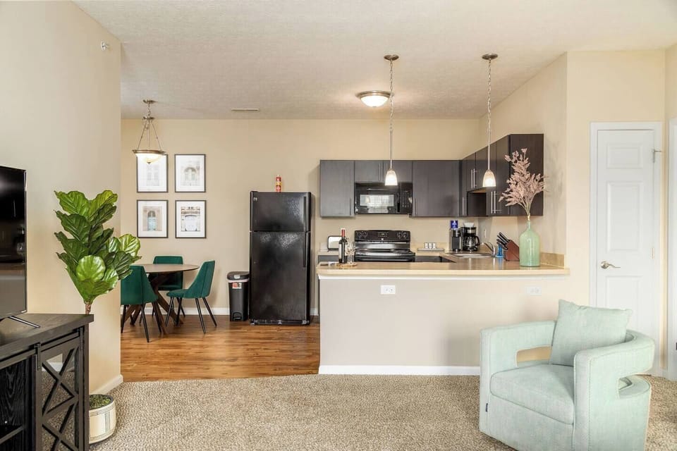 A view of the kitchen and dining area from the living room. 