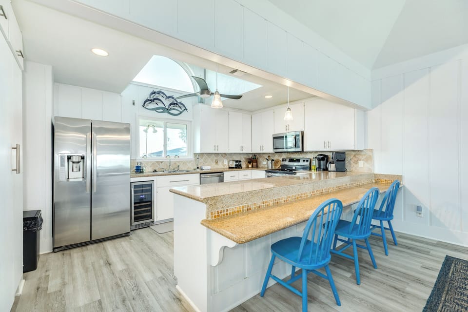 Grab a quick bite or enjoy meals at the breakfast bar seating 5