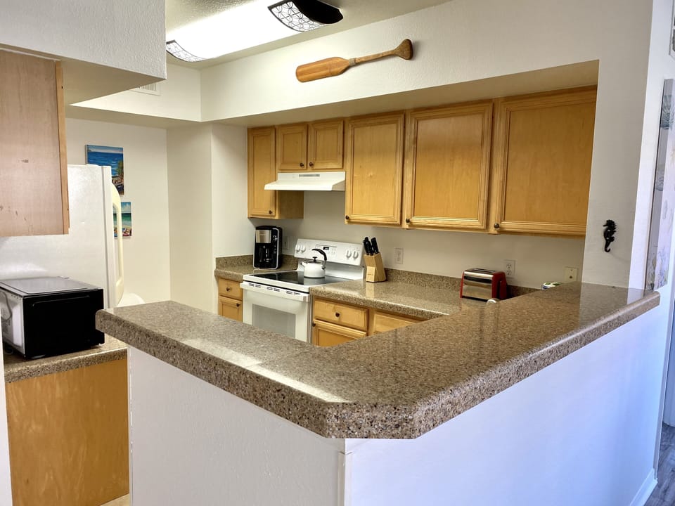 Stunning engineered stone counters; new GE glass top stove/oven; new microwave 