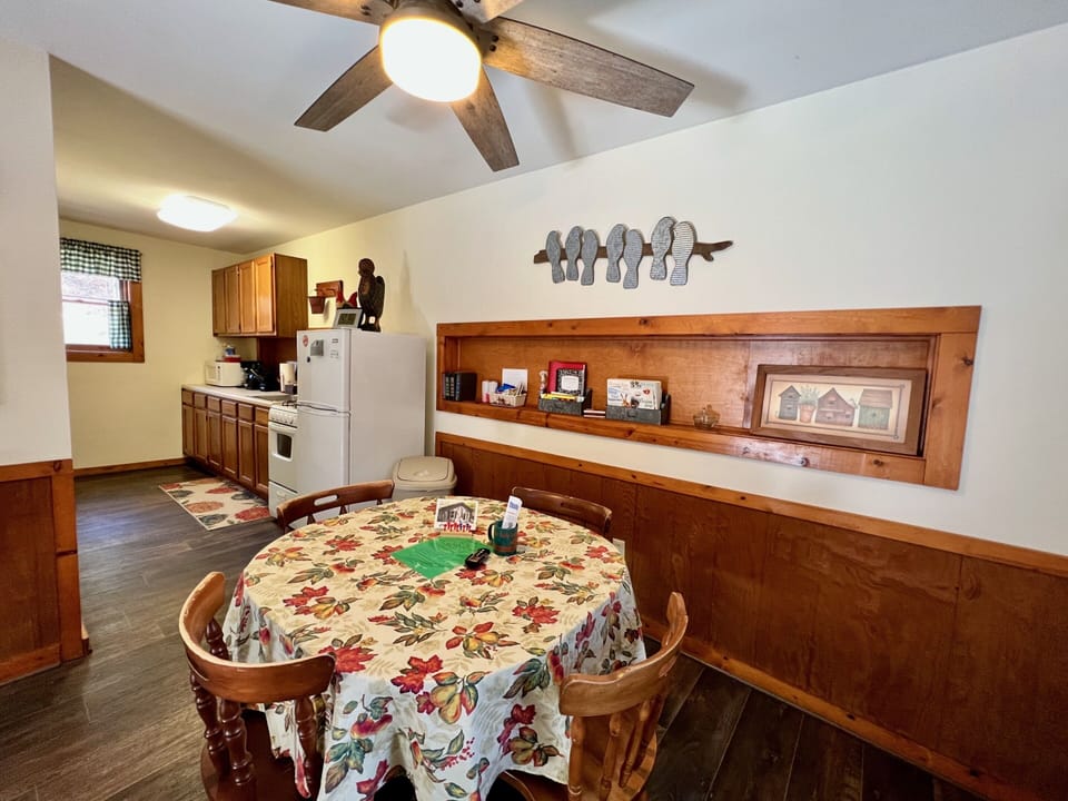 Dinning room is opened to the kitchen, features a large ceiling fan 
