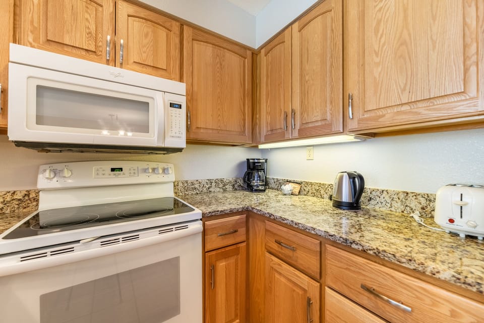 Your fully equipped kitchen features granite countertops, oak cabinets, and all the appliances you need for home cooking.