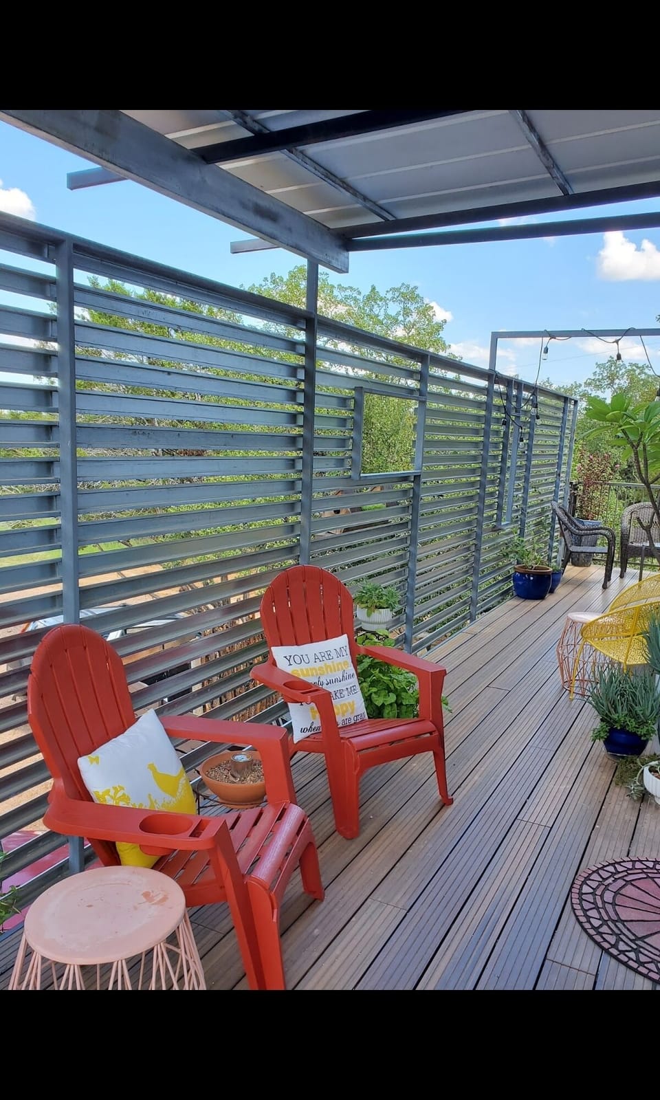 Covered main entrance and deck with plenty of outdoor seating. 