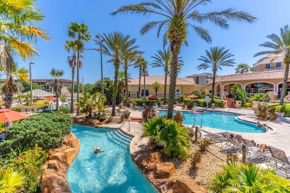 Enjoy and endless Florida summer in the beautiful resort pool featuring a lazy river and water slide!