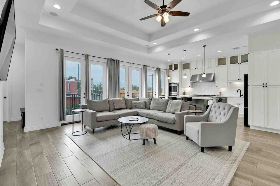 Open concept living/kitchen area. Balcony views of Padre Blvd.