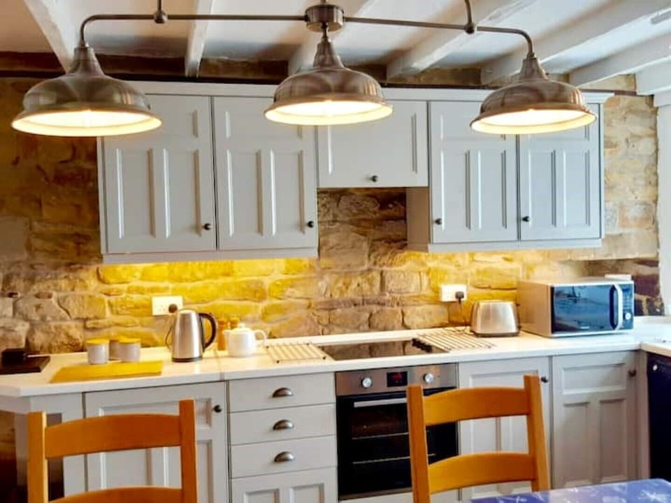 It's lit by an overhead lantern, and under-cupboard lighting 