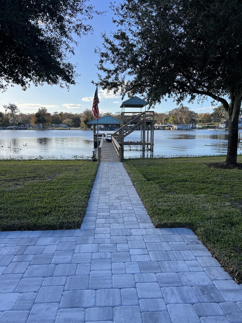 Paver walkway to dock with upper deck.