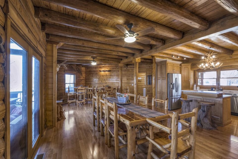 Dining room w/ real-log ceilings, hardwood floors and cedar dining tables/chairs