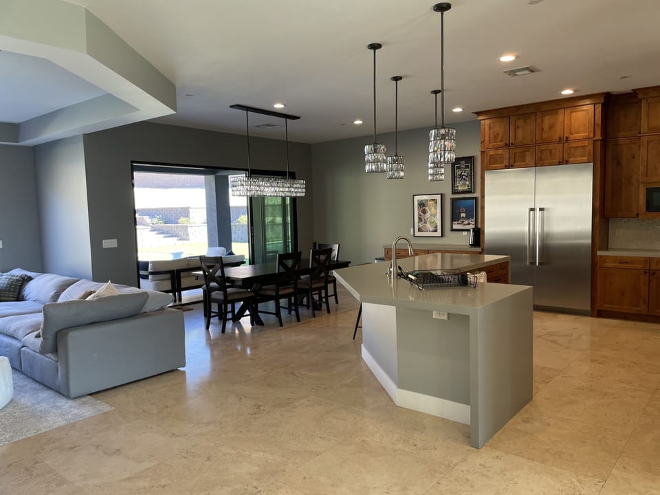 Kitchen, dining room with 4 chairs and a bench. Thermador appliances.